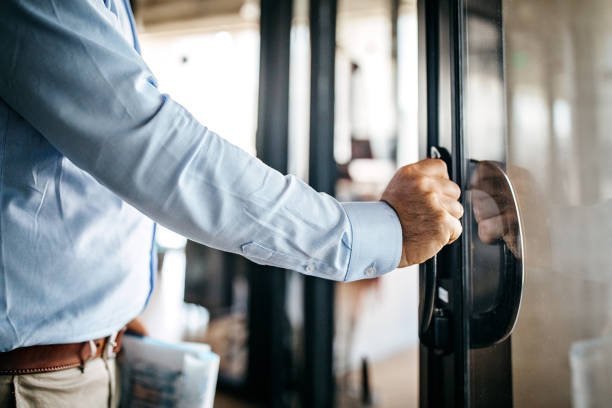 Businessman Opening Door Entering Office Cabin